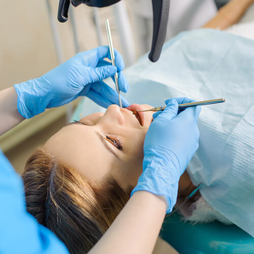 person receiving a dental exam